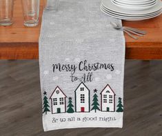 a christmas table runner with the words merry christmas to all and snowflakes on it