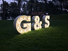 a sign that says g & s in the grass