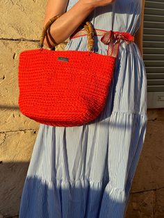 Enjoy the bright coral we chose for this crochet bag. Recycled cotton for a circular economy. Bamboo handles for a chic touch. Wear it as shoulder bag or handbag. The must have for your days at the beach.    Handmade bag: crochet technique; coral recycled cotton; bamboo handles.     Weight: 1020 gr. External measures: length 38 cm, height 25 cm, depth 18 cm.  The bag will be shipped in its dustbag.  Jeleja is a European brand born in 2021. We create handmade jewelry and bags. The idea was to bui Crochet Beach Bags, Crochet Handbag, Bamboo Bag, Circular Economy, Bamboo Handles, Handmade Bag, Bag Crochet, Summer Gift, Crochet Handbags