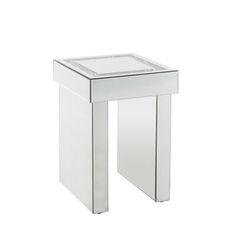 a white side table with a glass top