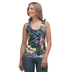 This body-hugging tank top is a must-have, now offering FREE SHIPPING to the US, Canada, EU, and UK! The artwork This artwork is an enchanting portrayal of Alpine flowers, set in a serene mountainous landscape. It captures a diverse array of wildflowers blooming amidst rocky terrains and dark, lush foliage. The painting features a rich palette of soft oranges, pinks, yellows, and purples, reflecting the delicate beauty and variety of flowers found in high-altitude regions. The composition is bot Workspace Essentials, Alpine Flowers, Alpine Meadow, French Collection, Spring Collection, Laptop Sleeves, Wild Flowers, Tank Tops Women, Womens Tops