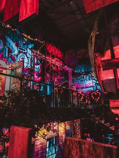 the interior of a building with graffiti all over it