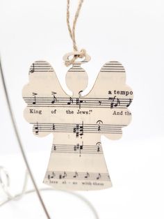 an angel ornament with music notes on it