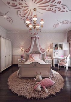 a bedroom with a bed, dresser and chandelier in the middle of it