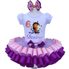 I offer you a beautiful birthday tutu outfit girls. NOTES FOR THE SELLER -Number for personalizing the top. -Name to personalize the vertex. -Need by date. Sleeve for the top - short, long. TOP. The top of it is 100% cotton. Size 3-24 months it is a bodysuit, 2T-10T it is a shirt. (Since it is more handmade always remember the shirt needs to be washed inside out, hand washed and air dried). SKIRT - made of soft tulle, edged at the bottom with a ribbon and decorated with a bow. Tutu is planted on Cute Purple Tutu Dress For Birthday, Purple Cute Tutu Dress For Birthday, Gabby Cat Birthday Party, Gabby Birthday, Dollhouse Dresses, Birthday Tutu Outfit, Cat Birthday Party, Birthday Party Theme Decorations, Girl Tutu