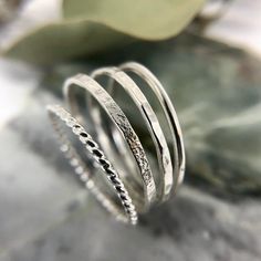 materials:•Sterling Silver Check out these minimalist bands in 14K Goldfill.size:•1.2mm bandstyle:•Smooth•Hammered•Textured•Birch•Rope: sold outThe perfect simple ring!Wear alone for a minimalist look or stack 'em up to make a statement.Also available in solid 14K Gold.Follow along @openfirejewellery.Handmade in Canada using quality materials.Carefully made & intentionally designed for long term wear. Minimalist Hammered Silver Stackable Rings, Minimalist Hammered Open Band Ring, Minimalist Hammered Ring With Open Band, Minimalist Sterling Silver Bands For Everyday, Minimalist Stackable Adjustable Bands, Everyday Minimalist Sterling Silver Bands, Minimalist Hammered Round Band Ring, Minimalist Hammered Sterling Silver Midi Rings, Minimalist Open Band In Sterling Silver