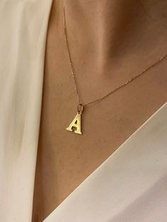 "ABOUT PRODUCT This 14K Solid Gold Initial Pendant necklace is beautifully designed and hand crafted with our associates to make this a special gift for your loved ones. Knowing the value of our customers, We prepare each piece with extra care and attention. ITEM DETAILS Material: 14K Gold Approx: 1.80 gram Available colors: Gold, Rose Gold, White Gold Available Sizes: 14\" to 20\" ✪ 14k Solid Gold ( Certification will be included with your order ) ✪Available 14K White, Yellow, Rose Gold (also i Everyday Diamond Initial Pendant Necklace, Fine Jewelry Initial Pendant Necklace For Everyday, Everyday Fine Jewelry Initial Pendant Necklace, Everyday Fine Jewelry Initial Necklace, Minimalist Handmade Heart Pendant Necklace, Modern Yellow Gold Initial Pendant Necklace, Handmade Everyday Necklaces With Initial Pendant, Handmade Everyday Initial Pendant Necklace, Modern Pendant Charm Necklace For Gift