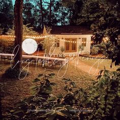 an image of a house with lights in the yard and trees around it at night