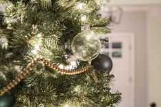 a christmas tree with ornaments hanging from it