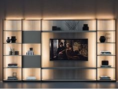 an entertainment center with several shelves on each side