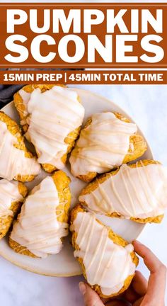 pumpkin scones on a white plate with frosting