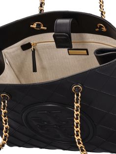 Find TORY BURCH Fleming Quilted Leather Shoulder Bag on Editorialist. The TORY BURCH Fleming Shoulder Bag is crafted from quilted leather and features a gold-tone chain strap and logo details. The bag has a top handle with a drop of 23cm, and measures 28cm in height, 35cm in width, and 26cm in depth. Quilted Leather Bag With Double Handle, Quilted Leather Shoulder Bag For Travel, Quilted Leather Shoulder Bag With Double Handle, Quilted Leather Shoulder Bag, Classic Quilted Tote Shoulder Bag, Luxury Quilted Shoulder Bag For Everyday Use, Luxury Quilted Double Handle Bag, Luxury Quilted Shoulder Bag For Travel, Elegant Quilted Leather Bags