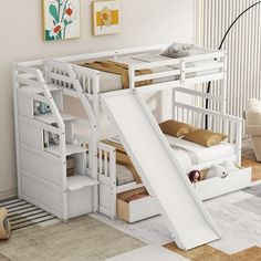 there is a bunk bed with a slide in the middle and stairs up to it