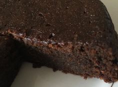 a chocolate cake with one slice missing from it