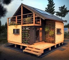 a small wooden house with plants growing on the roof