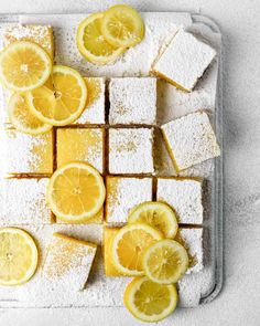 lemon and sugar squares are arranged on a tray