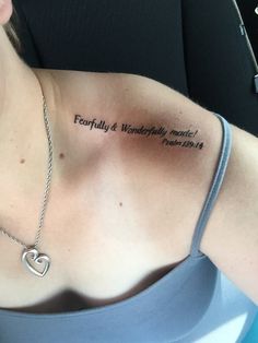 a woman with a heart tattoo on her chest and the words fearlessly & wonderful inside