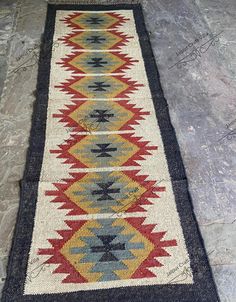 an old rug is laying on the floor