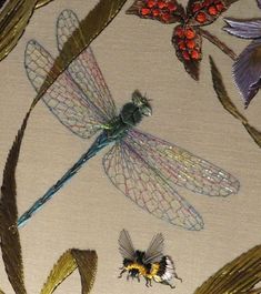 three dragonflies and two bees on a beige background