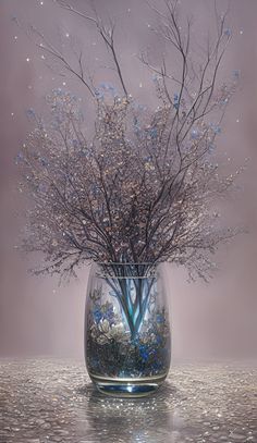 a glass vase filled with lots of flowers on top of a table next to a wall