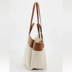 Mixed Tote Bag. Canvas Fabric Exterior. Handles And Shoulder Straps. Magnetic Closure. Height X Length X Width: 19.7 X 12.2 X 5.1 Inches (50 X 31 X 13 Cm) Dark Tan Beige Shoulder Bag With Removable Pouch For Errands, Luxury Beige Bucket Bag For Errands, Beige Satchel Hobo Bag For Errands, Neutral Hobo Tote Bag With Leather Handles, Neutral Hobo Bag With Leather Handles Tote Shape, Everyday Beige Hobo Bag With Leather Handles, Luxury Beige Bucket Bag With Large Capacity, Elegant White Canvas Bag With Large Capacity, Luxury Beige Canvas Bag With Handles