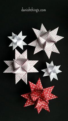 several paper stars are arranged on a black surface with the words, how to make origami stars