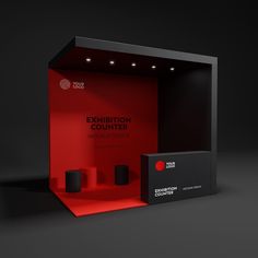 an exhibition case with two speakers in it and a red box on the right side