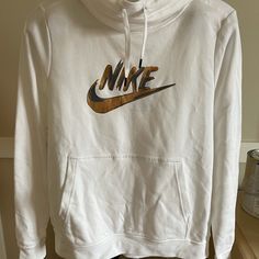 Brand New With Tags. Women’s Large Hooded Nike Sweatshirt With Cowl Neck. Loose Fit. White Branded Tops For Fall, Nike White Sweatshirt With Letter Print, Nike White Crew Neck Sweatshirt, Nike White Hooded Sweatshirt, Nike Casual Sweatshirt With Moisture-wicking, Nike White Sweatshirt With Logo Print, Nike White Graphic Print Sweatshirt, Nike Crop Top Hoodie, Nike Fleece Hoodie