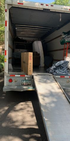 the back of a moving truck loaded with boxes