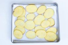 sliced potatoes on a baking sheet ready to be baked in the oven or used as an appetizer