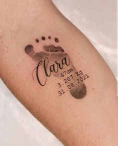 a close up of a person's arm with a tattoo on it that says clara