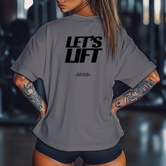 Ready to make a statement in the gym? Our "Let's Lift" unisex gym shirt is designed for those who take their workouts seriously and want to show it. Whether you're pushing through a tough lift or motivating yourself for that next set, this shirt embodies the spirit of hard work, dedication, and strength. - Unisex Fit: Designed to look great on both men and women. Available in a range of sizes to ensure the perfect fit for everyone. - Premium Quality Fabric: Made from a high-quality cotton-polyester blend, ensuring comfort, breathability, and durability. Perfect for intense gym sessions or casual wear. - Perfect for All Workouts: Whether you're lifting, doing cardio, or hitting your favorite group class, this shirt will keep you comfortable and motivated. Make every rep count in style. Grab Gray Athleisure T-shirt With Letter Print, Sportswear Stretch T-shirt With Letter Print, Stretch Sportswear T-shirt With Letter Print, Stretch Letter Print T-shirt For Sportswear, Gray Sportswear T-shirt For Gym, Gray Short Sleeve Activewear For Gym, Gray Relaxed Fit Top For Gym, Gym Shirt With Letter Print And Short Sleeves, Athleisure Gym Activewear With Text Print