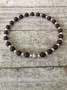 This beautiful anklet is made up of the deep rich Garnet often described as "Living Fire". It is a deeply spiritual stone that embodies all the qualities of love. It is a stone of Passion.  Materials: 6mm Genuine Grade A Garnet, 4mm silver finding, Durable Stretch Cord, Loving Energies  Your anklet will come beautifully packaged inside a gift bag along with a description of the gemstone properties. Your stones will be cleansed and blessed with loving intentions and all will be Made with Care & Love.  Sizing Guideline  8.5 Petite 9 Small 9.5 Medium 10-10.5 Large 11 X Large  Anklets should hang just below the ankle bone. Measure with a measuring tape just below the ankle bone or wherever you want the anklet to sit, then add 1/4 to 1/2 inch depending on how loose you want it to fit.  Love & L January Capricorn, Love Spiritual, Capricorn Gifts, Beautiful Anklet, Gemstone Properties, Love Energy, Ankle Bones, Spiritual Gifts, Root Chakra