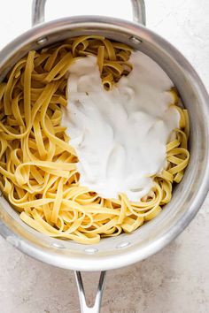 pasta being cooked in a pot on the stove