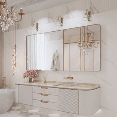 an elegant bathroom with marble counter tops and gold accents