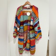 Luxuriously Long And Made With High Quality Coloured Yarns, This Knitted Coat Brings Style To Any Outfit. Composition: 70%Mohair, 20% Alpaca, 5% Polyamide, 5% Metallic. Multicolor Long Cardigan For Layering, Long Multicolor Cardigan For Layering, Multicolor Acrylic Outerwear For Layering, Multicolor Knitted Outerwear For Layering, Multicolor Soft Knit Cardigan For Fall, Multicolor Long Sweater For Fall, Long Multicolor Sweater For Fall, Fall Multicolor Soft Knit Cardigan, Multicolor Knitted Sweater Coat For Fall