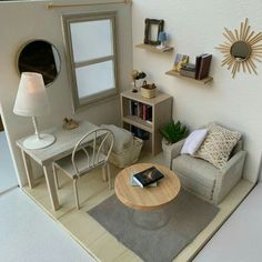 a living room filled with furniture next to a book shelf and window on the wall