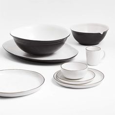 black and white dinnerware set with matching saucers