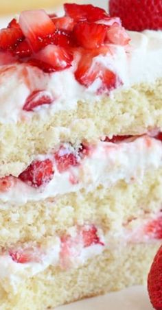 two slices of cake with strawberries on top