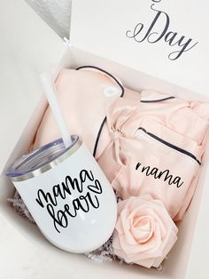 a baby gift set in a box with its mother's name on the cup