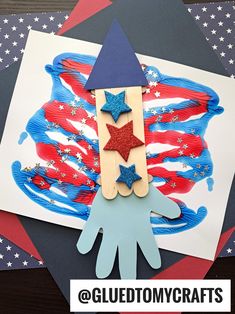 an american flag craft made out of popsicle sticks with stars on it and the words glue town crafts