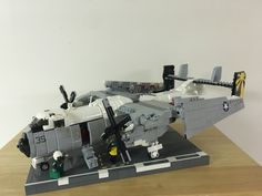 a lego model of a fighter jet sitting on top of a wooden table