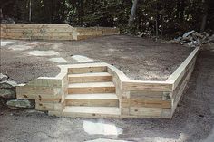 an outdoor area with stairs and steps made out of wood