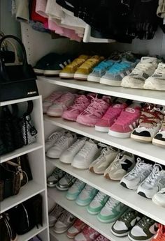 a closet filled with lots of shoes and handbags