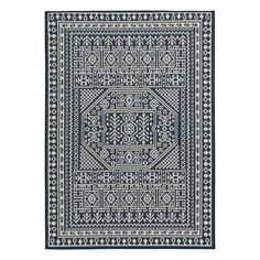 a blue and white rug with an intricate design on the bottom, in front of a white background