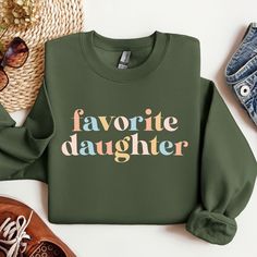 Favorite Daughter Sweatshirt, Favorite Family Member Sweatshirt, Funny Daughter Hoodie,  Gift for Daughter, Daughter Crewneck Sweater Welcome to ApparelByMoliva High quality and super soft comfortable sweatshirts are prepared with new technology DTF and a professional quality heat press.  # HOW TO PLACE AN ORDER? #   Please check the size, color and theme of all images in this listing. * Choose the size and color of the shirt from the menus. * Fill the empty box with your design color for personalization. Please refer to the photos in this listing to see what colors are available.   (Example: Design Color Black) * Choose the amount * Add to Basket * Proceed to checkout   Note1: Please ask for sizes and colors that are not in our size chart.   Note2: Durable 50% Cotton/50% Polyester Blend: Green Fleece Sweatshirt With Letter Print, Favorite Daughter, Gift For Daughter, Design Color, Crewneck Sweater, New Technology, Heat Press, Family Members, Crew Neck Sweater