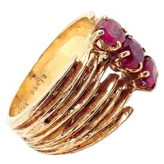 About This Piece: An authentic, vintage Cartier ring, crafted from luxurious 18k yellow gold, featuring three striking ruby at its heart. The design exemplifies Cartier's timeless elegance and attention to detail, making it a coveted piece for collectors and fashion enthusiasts alike. Its rich history adds to its allure and value. Metal: 18k Yellow Gold Size: 4.5, Resize Available Weight: 5.7 grams Stones: 3x Round Ruby Stones Hallmarks: Cartier Paris 18kt 01xxxx(serial omitted)French Hallmarks Luxury Gold Three-stone Ruby Ring, Classic Yellow Gold Three Stone Ruby Ring, Luxury Gold Ruby Three Stone Ring, Luxury Gold Three Stone Ruby Ring, Classic Three Stone Ruby Ring In Yellow Gold, Luxury Gold Ruby Ring With Three Stones, Classic Three Stone Yellow Gold Ruby Ring, Three Stone Ruby Ring In Yellow Gold, Vintage Yellow Gold Three Stone Ruby Ring