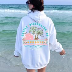 Soak up the serene vibes with our Sunset Summer Hoodie. This cozy sunset hoodie, perfect for beach lovers, captures the beauty of a beach sunset. Ideal for those who are easily distracted by sunsets, this beach sweatshirt blends comfort with a stunning sunset design. Elevate your beachy aesthetic and enjoy the perfect evening with our Sunset Sweatshirt. Whether you're strolling along the shore or relaxing at a bonfire, this beach hoodie is a must-have for your summer wardrobe. Casual Vacation Hoodie With Letter Print, Casual Letter Print Hoodie For Vacation, Casual Hoodie With Letter Print For Vacation, Casual Relaxed Fit Hoodie For Vacation, Casual Hoodie With Relaxed Fit For Vacation, Beach Season Vacation Hoodie With Crew Neck, Casual Beach Hoodie For Beach Season, Vacation Hoodie With Relaxed Fit And Long Sleeves, Vsco Style Long Sleeve Sweatshirt For Vacation