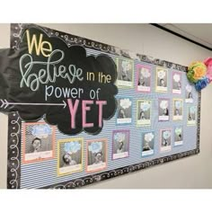 we believe in the power of yet bulletin board with pictures and balloons on it's side