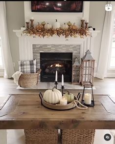 a living room filled with furniture and a fire place in front of a mantel